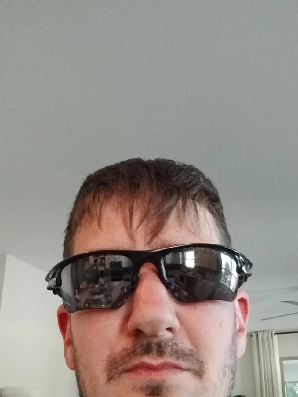 Oakley Black Frame Sunglasses with Gray And Orange Lenses